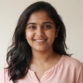 Priya, a smiling member from Seattle